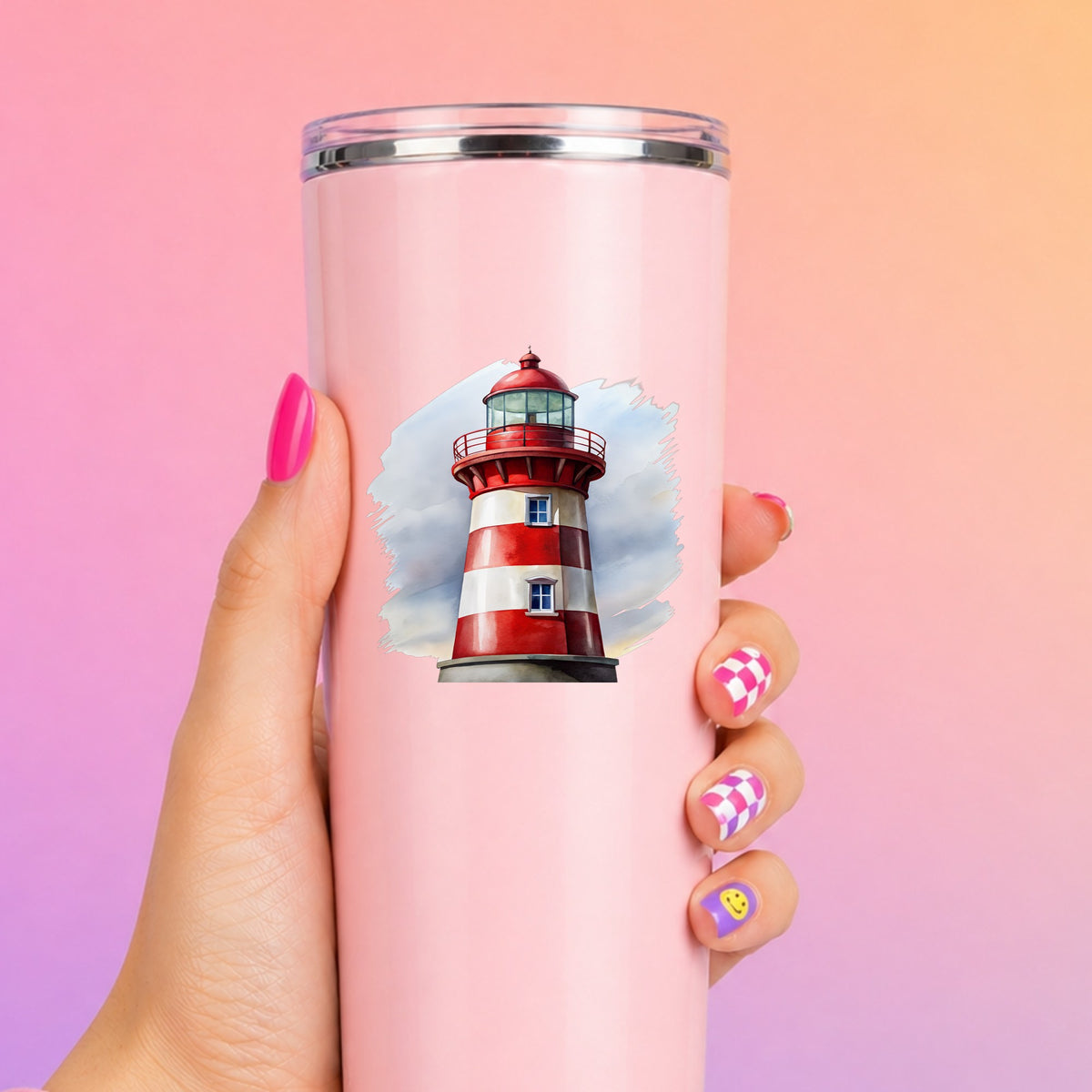 Red And White Lighthouse UV DTF sticker applied to a tall pink tumbler on a pink and orange background