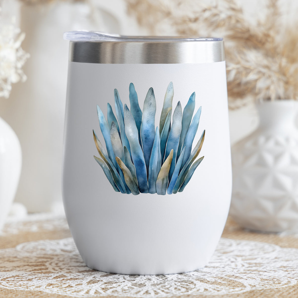 Blue Coastal Sea Grass UV DTF sticker applied to a white stemless tumbler with a lid