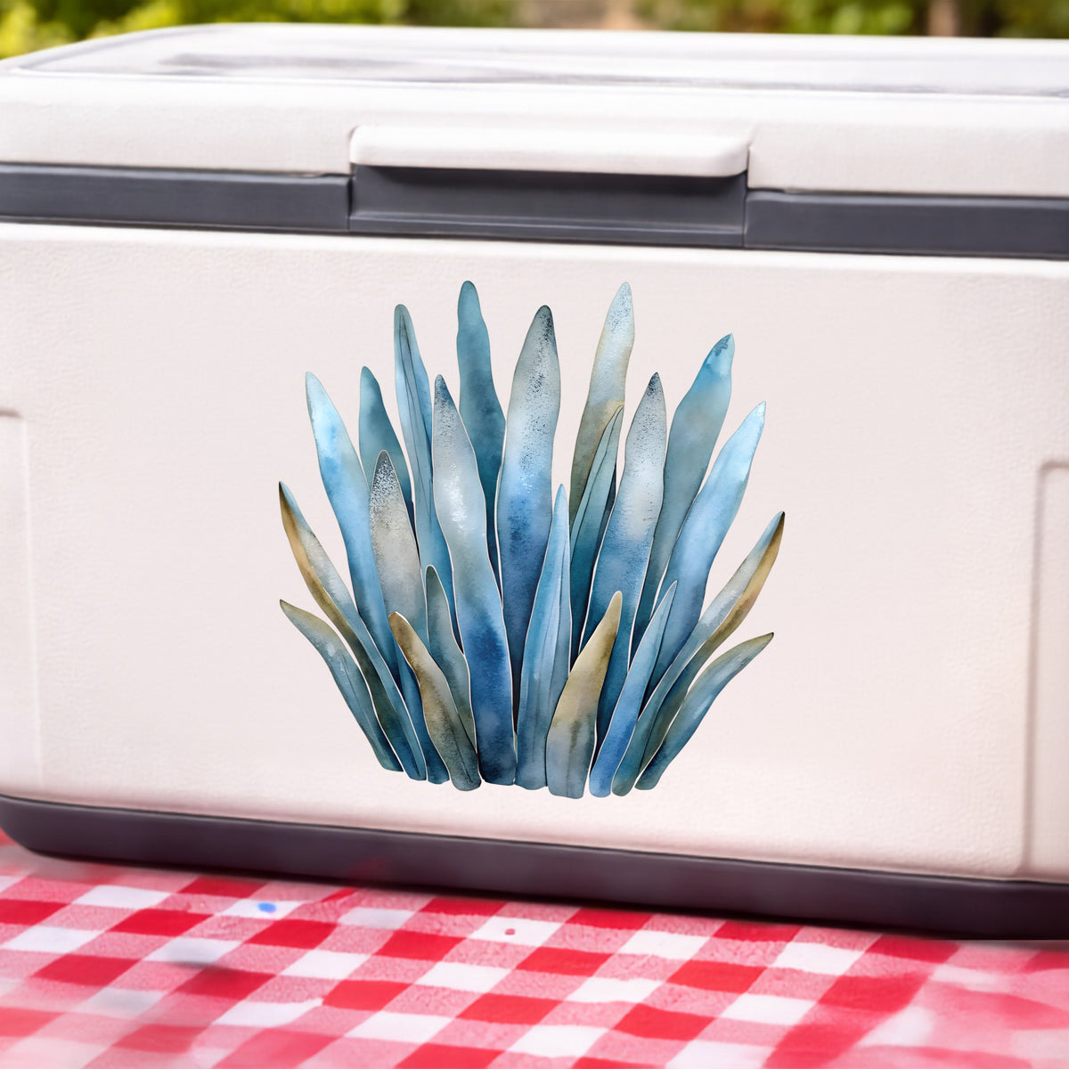 Blue Coastal Sea Grass UV DTF sticker applied to a white cooler on a red gingham cloth