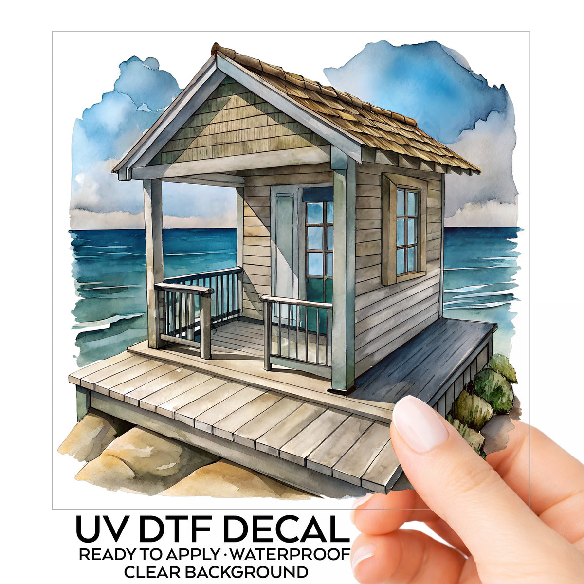 Beach Cottage Porch Ocean View UV DTF sticker on its backing card, held in hand
