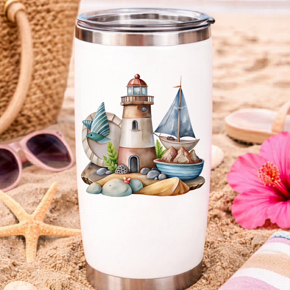 Lighthouse Sailboat Seaside Scene UV DTF sticker applied to a white travel tumbler on beach sand