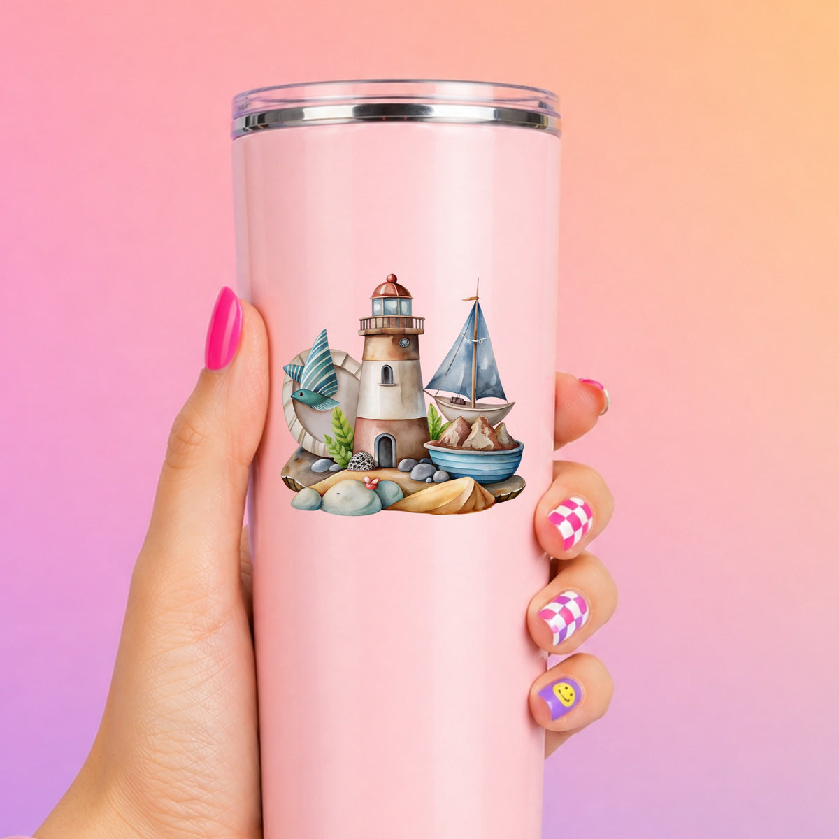 Lighthouse Sailboat Seaside Scene UV DTF sticker applied to a tall pink tumbler on a pink and orange background