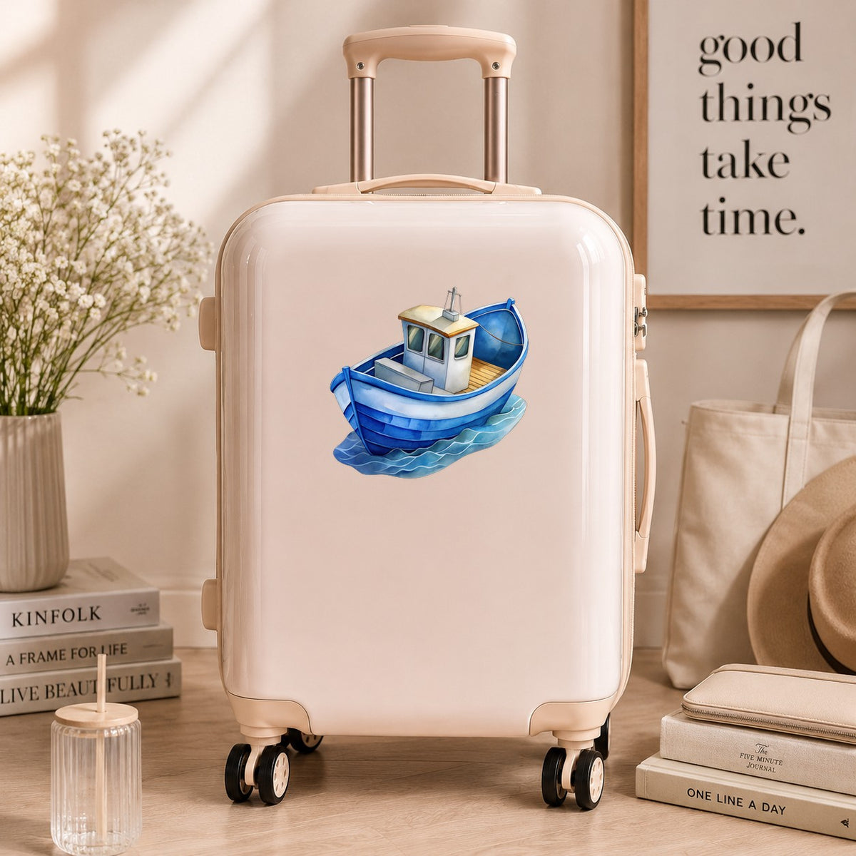 Blue Fishing Boat On Waves UV DTF sticker applied to a cream carry-on suitcase