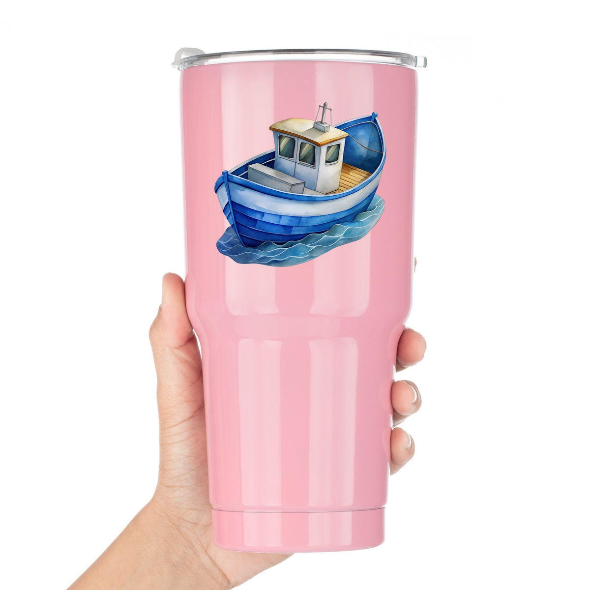 Blue Fishing Boat On Waves UV DTF sticker applied to a pink tumbler held against a white background