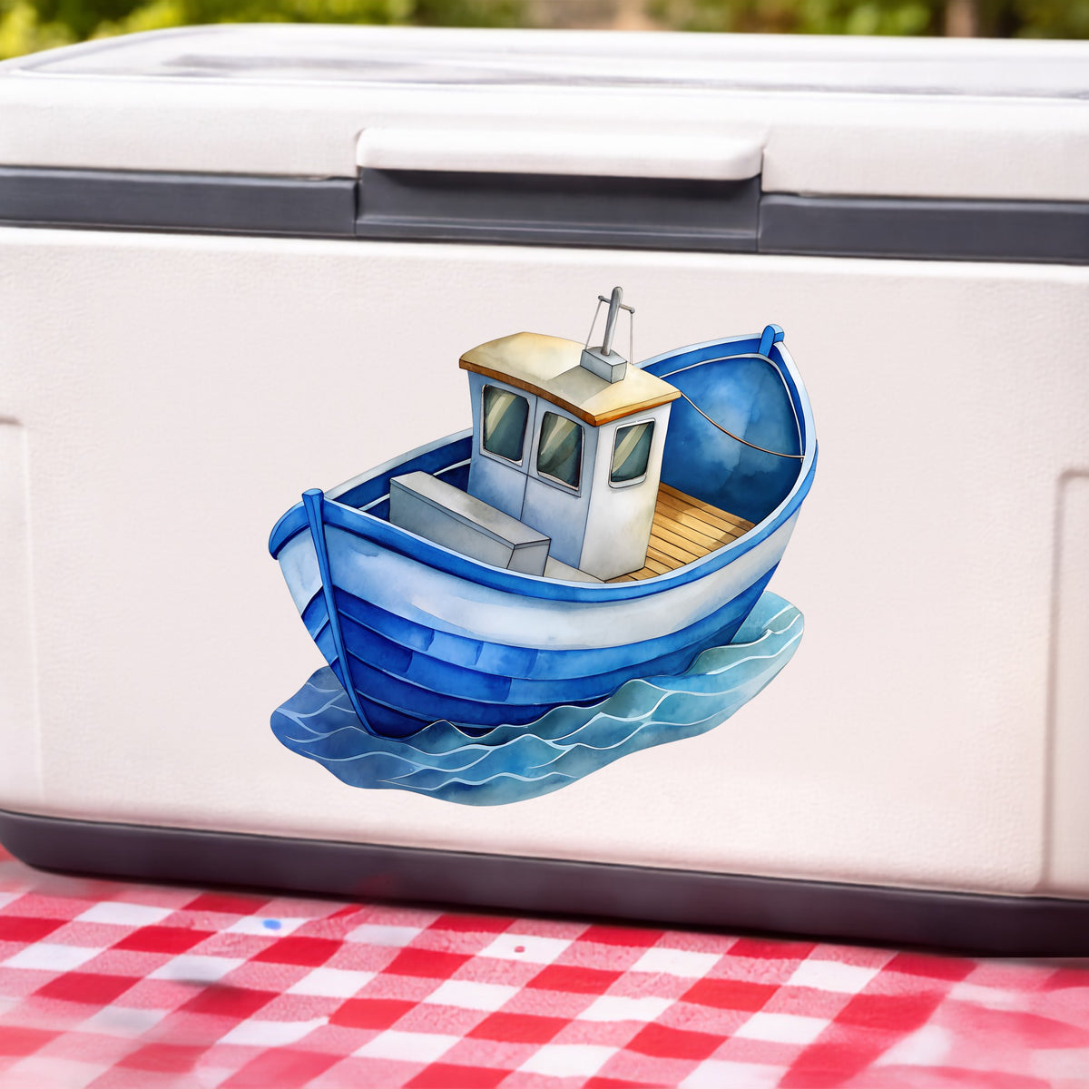 Blue Fishing Boat On Waves UV DTF sticker applied to a white cooler on a red gingham cloth