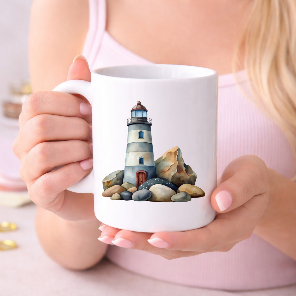 Lighthouse On Rocky Shore UV DTF sticker applied to a white coffee mug held in both hands