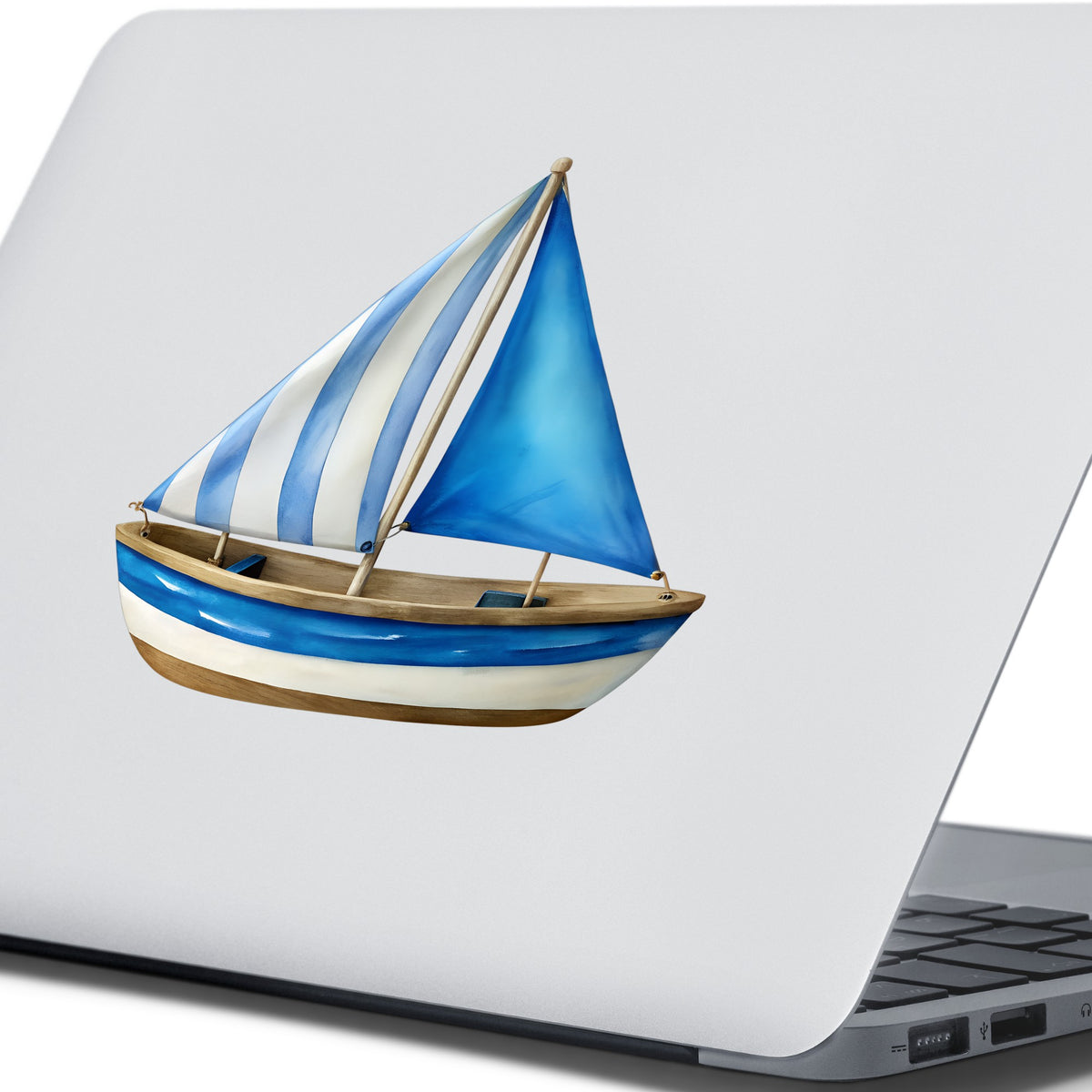 Blue Striped Sailboat UV DTF sticker applied to the lid of a silver laptop