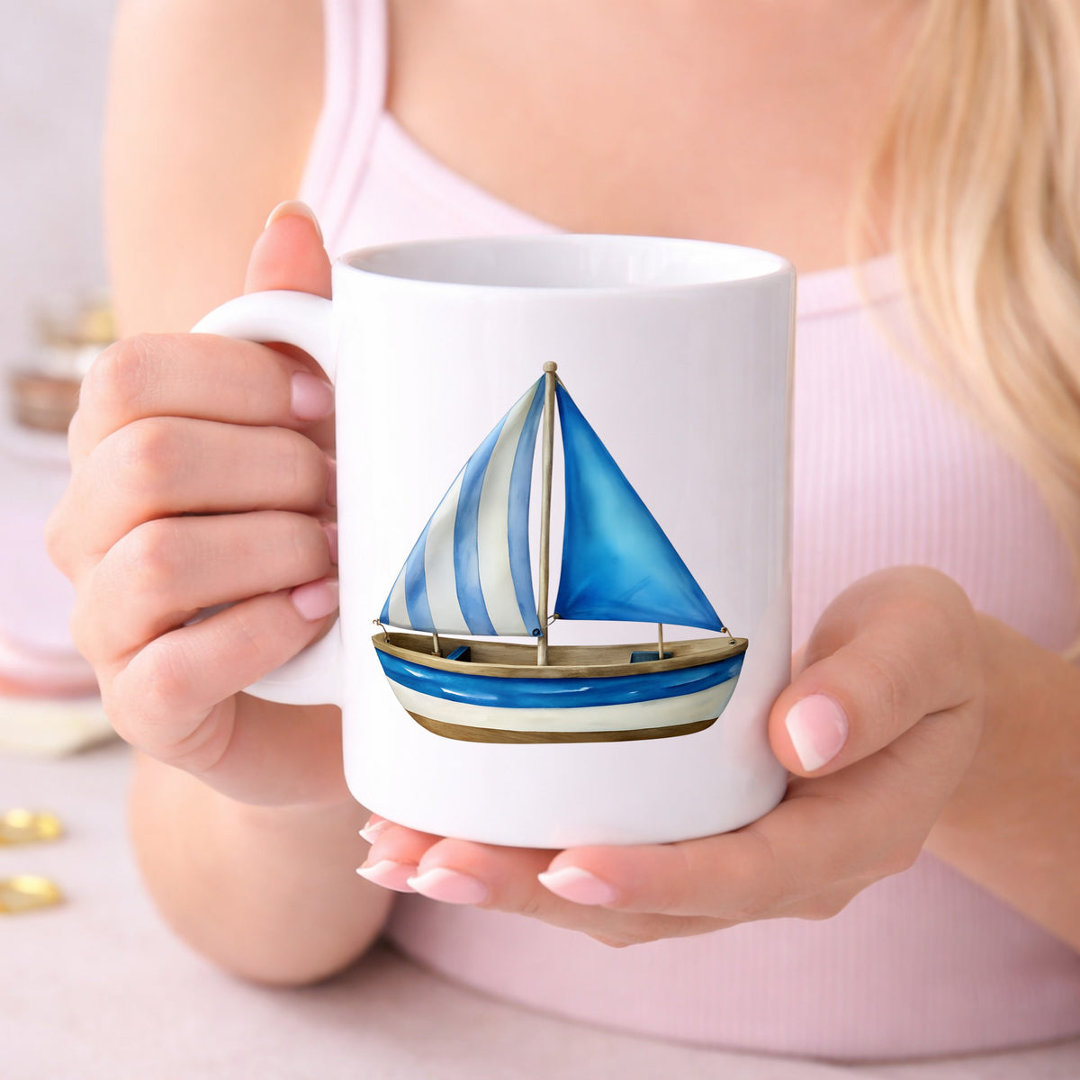 Blue Striped Sailboat UV DTF sticker applied to a white coffee mug held in both hands