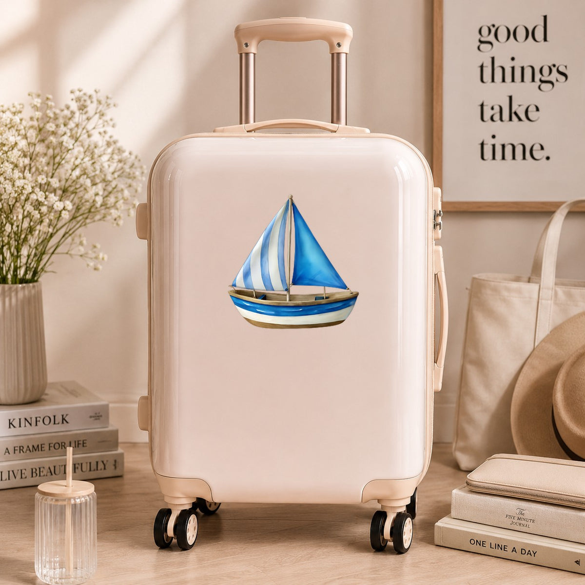 Blue Striped Sailboat UV DTF sticker applied to a cream carry-on suitcase