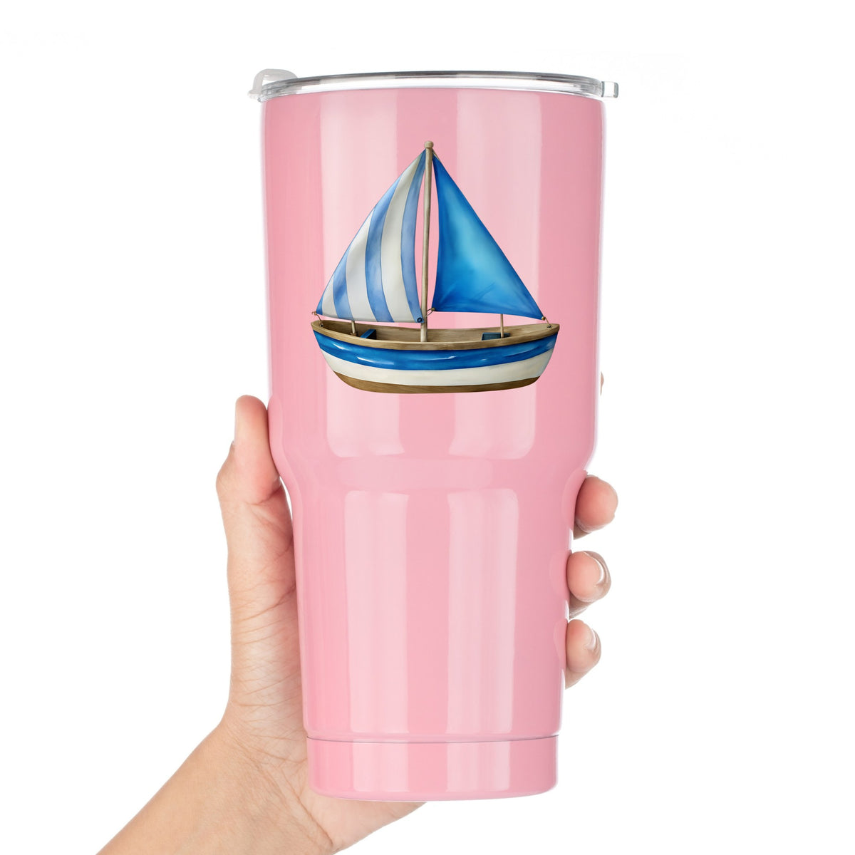 Blue Striped Sailboat UV DTF sticker applied to a pink tumbler held against a white background