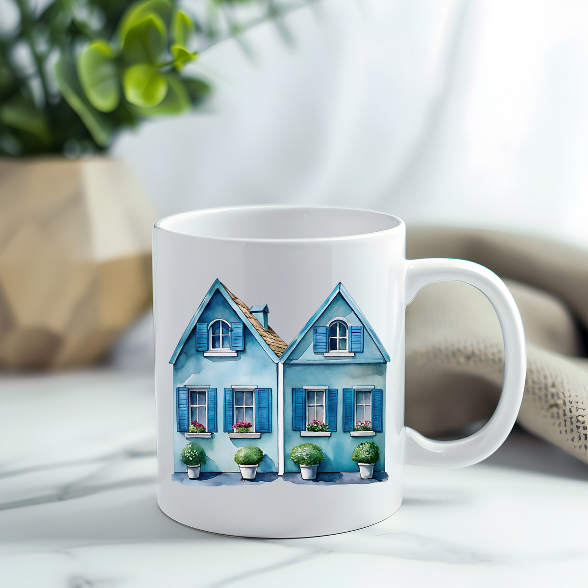 Two Blue Coastal Cottages UV DTF sticker applied to a white coffee mug