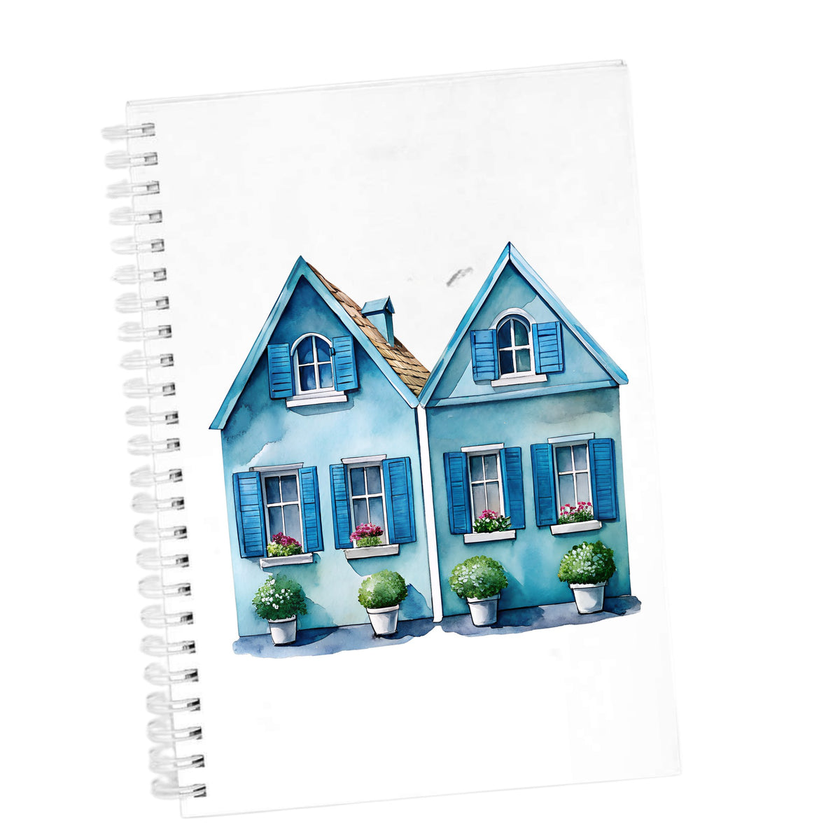 Two Blue Coastal Cottages UV DTF sticker applied to the cover of a white spiral journal