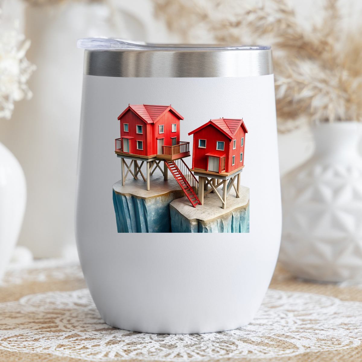 Red Houses On Stilts Cliff UV DTF sticker applied to a white stemless tumbler with a lid