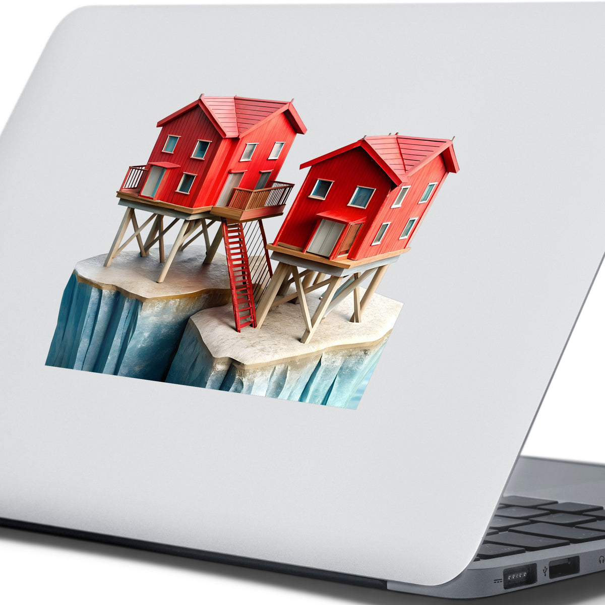 Red Houses On Stilts Cliff UV DTF sticker applied to the lid of a silver laptop