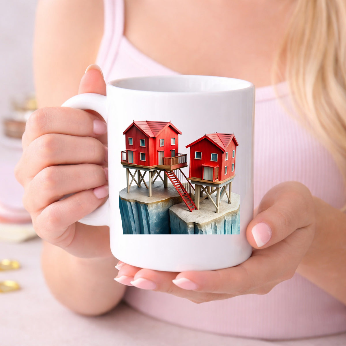 Red Houses On Stilts Cliff UV DTF sticker applied to a white coffee mug held in both hands