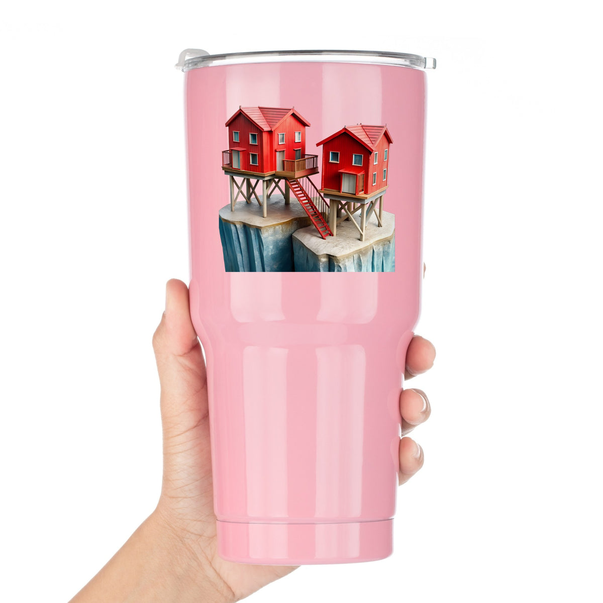 Red Houses On Stilts Cliff UV DTF sticker applied to a pink tumbler held against a white background