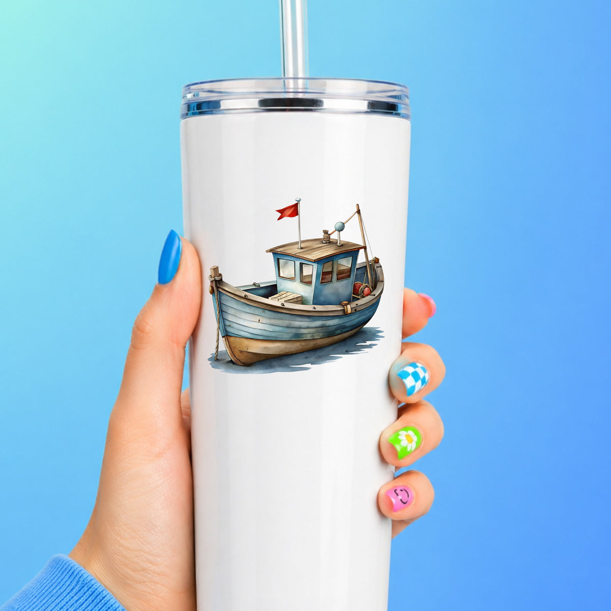 Wooden Fishing Boat With Red Flag UV DTF sticker applied to a white straw tumbler on a blue background