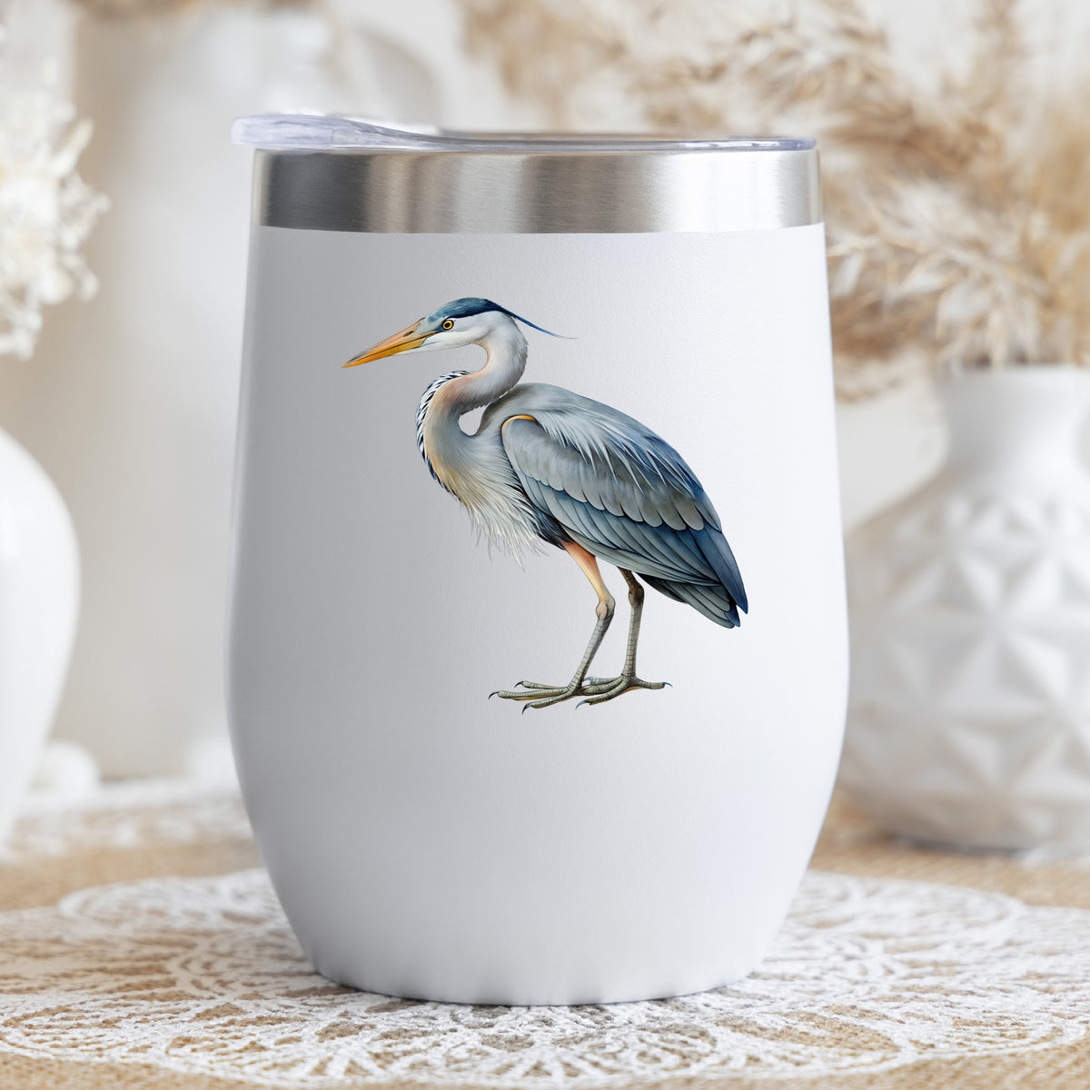 Great Blue Heron UV DTF sticker applied to a white stemless tumbler with a lid