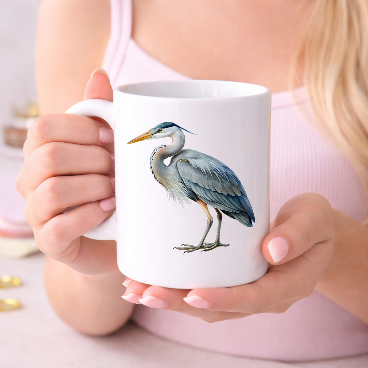 Great Blue Heron UV DTF sticker applied to a white coffee mug held in both hands