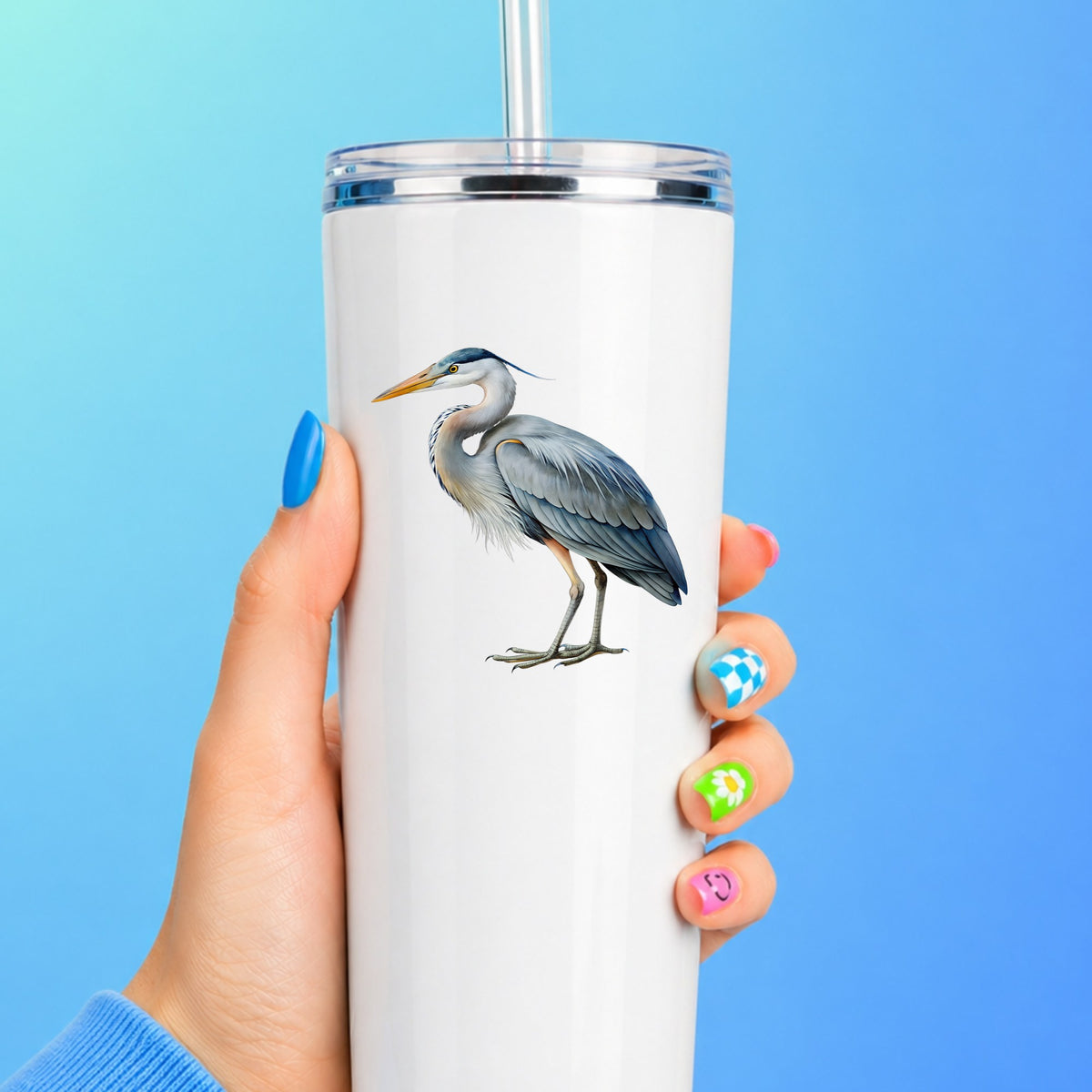 Great Blue Heron UV DTF sticker applied to a white straw tumbler on a blue background