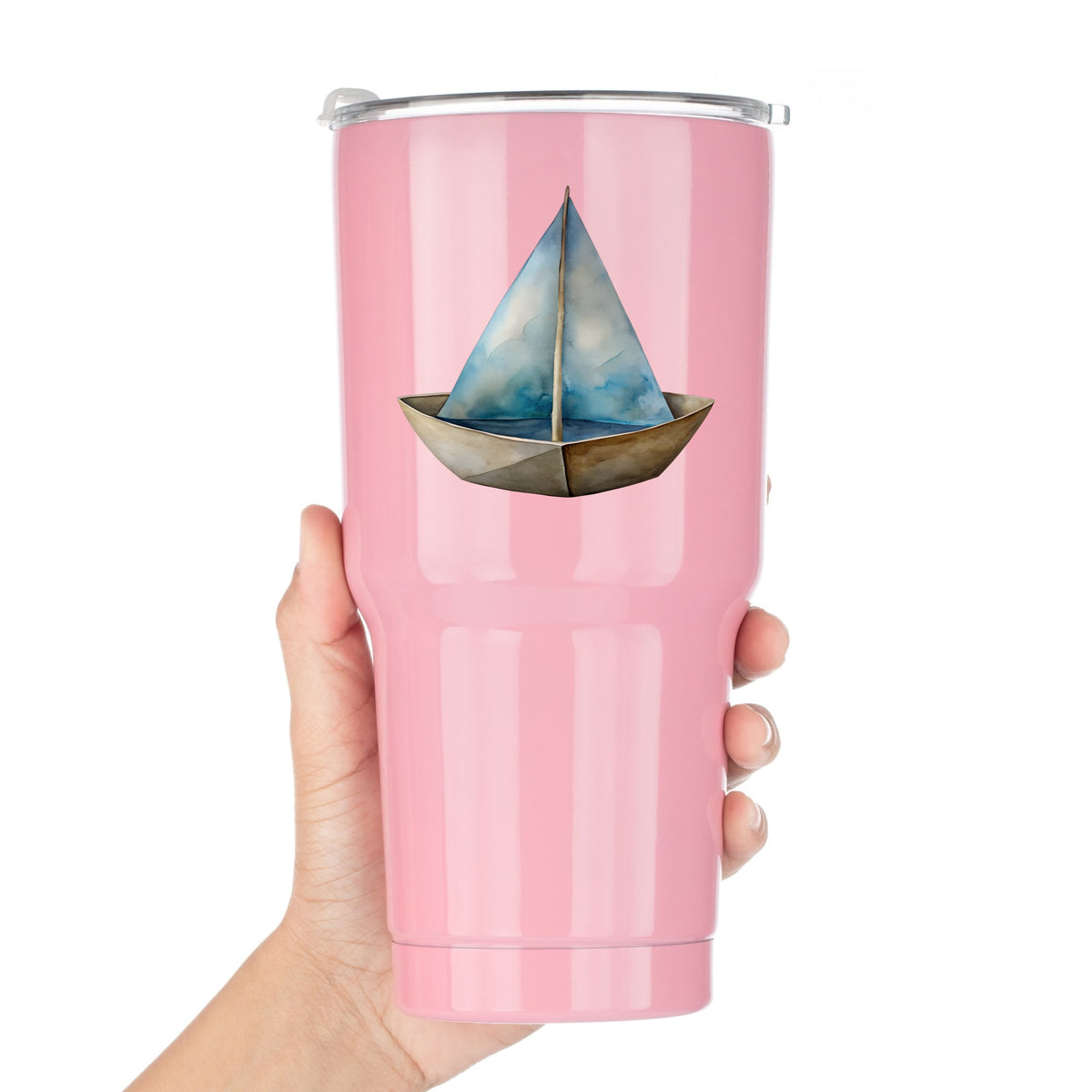 Paper Sailboat UV DTF sticker applied to a pink tumbler held against a white background