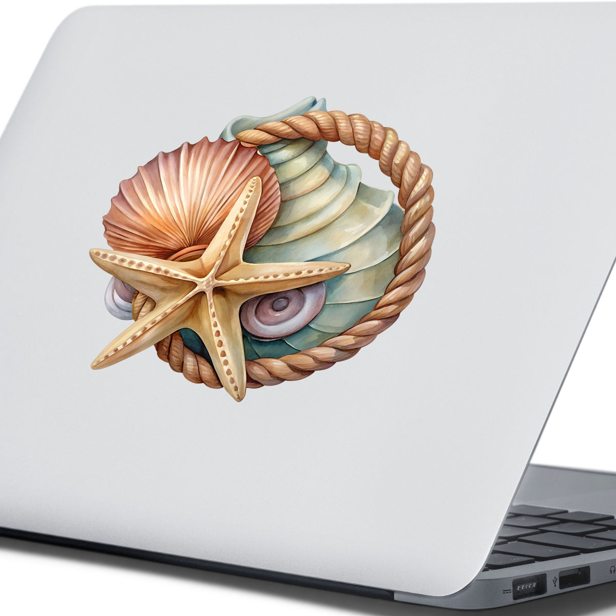 Seashells Starfish Rope Circle UV DTF sticker applied to the lid of a silver laptop