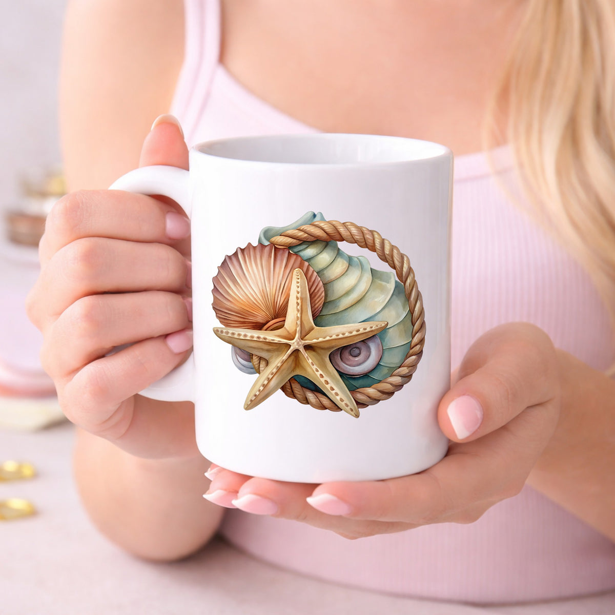 Seashells Starfish Rope Circle UV DTF sticker applied to a white coffee mug held in both hands