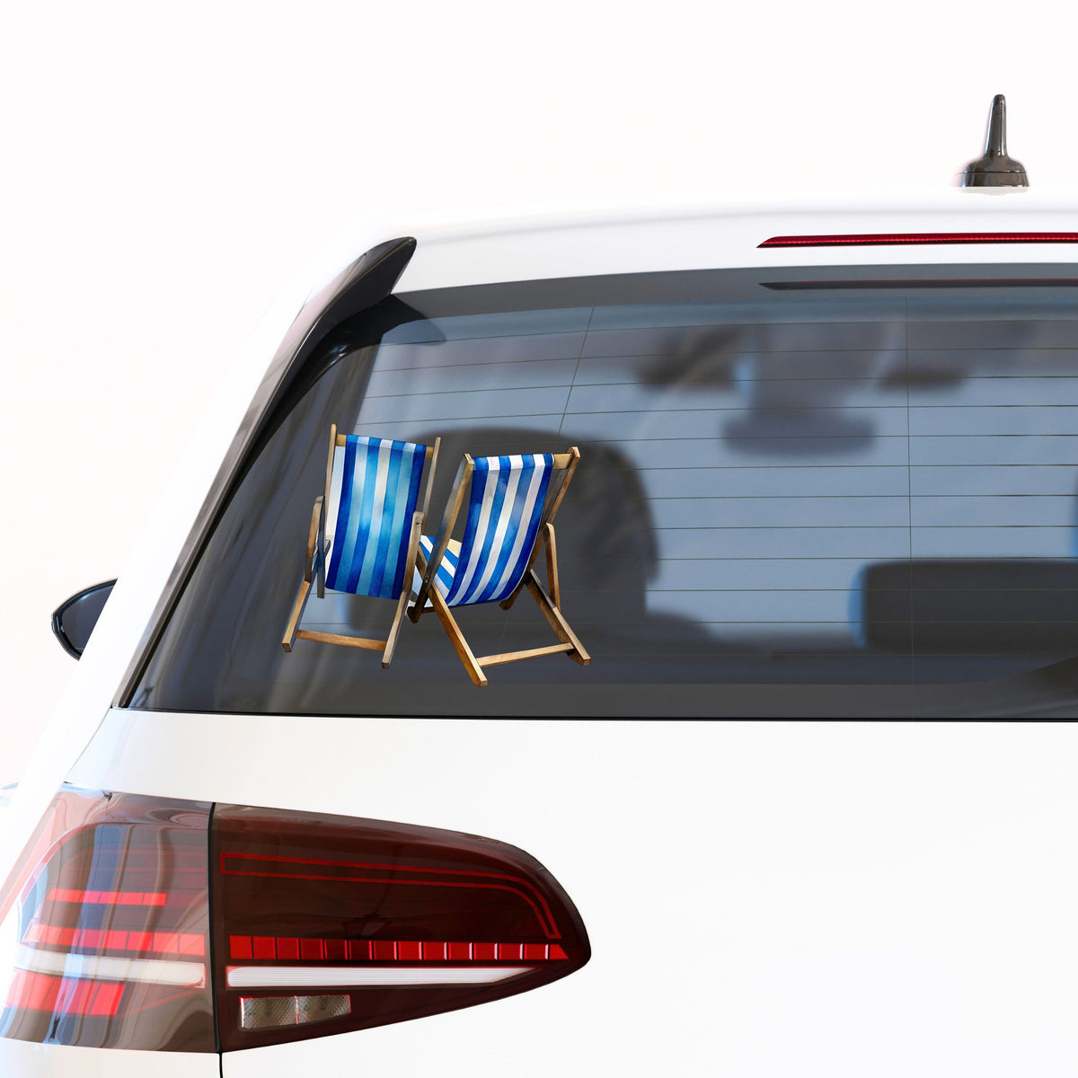 Two Blue Striped Beach Chairs UV DTF sticker applied to the rear window of a white car