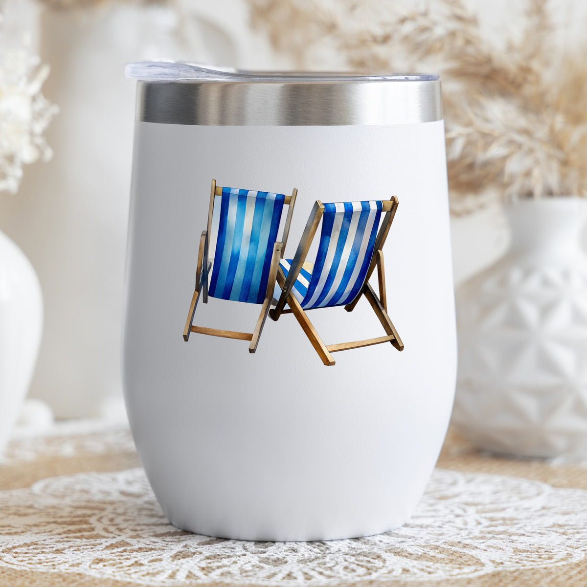 Two Blue Striped Beach Chairs UV DTF sticker applied to a white stemless tumbler with a lid