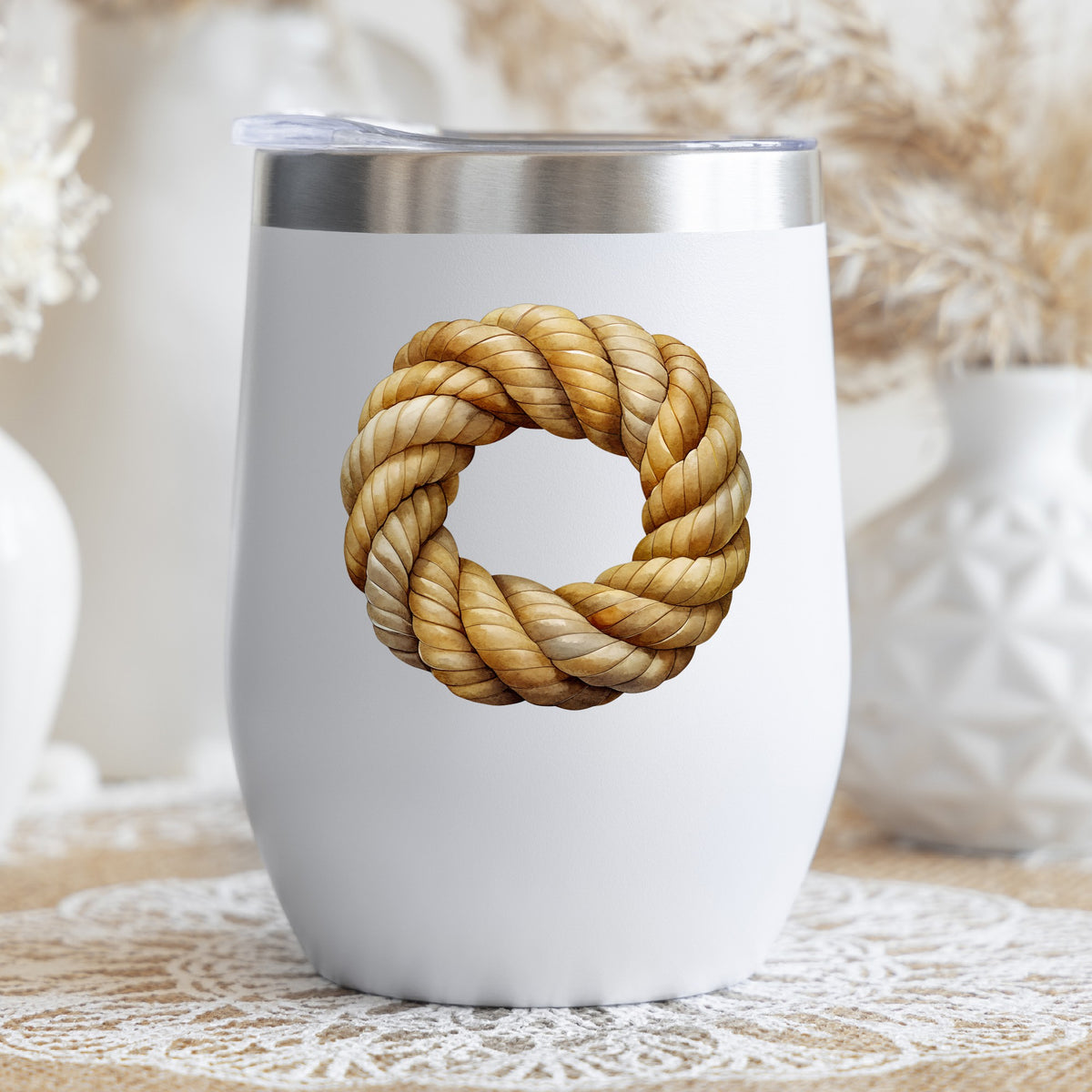 Rope Knot Wreath UV DTF sticker applied to a white stemless tumbler with a lid