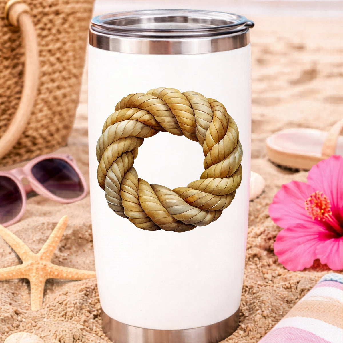 Rope Knot Wreath UV DTF sticker applied to a white travel tumbler on beach sand