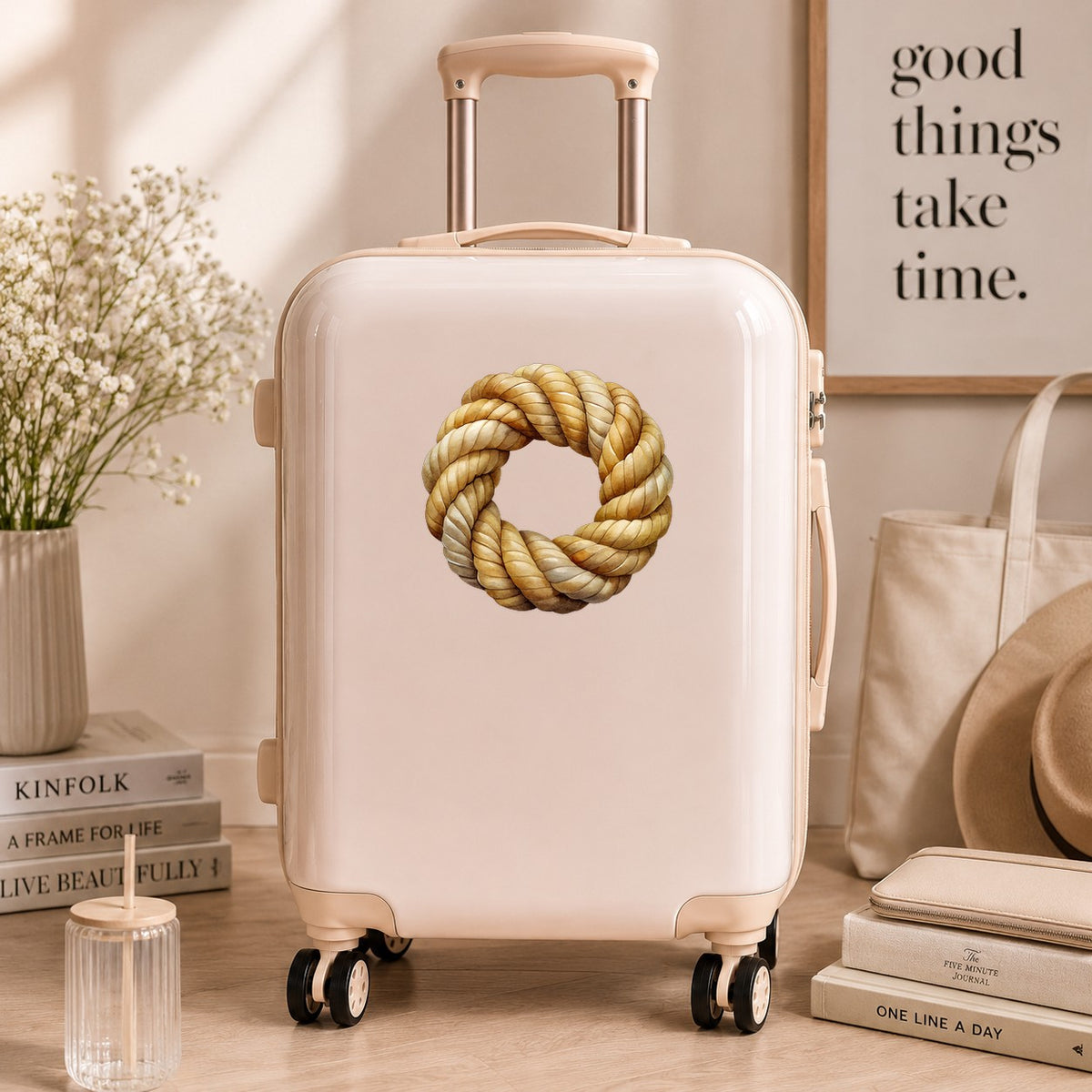 Rope Knot Wreath UV DTF sticker applied to a cream carry-on suitcase