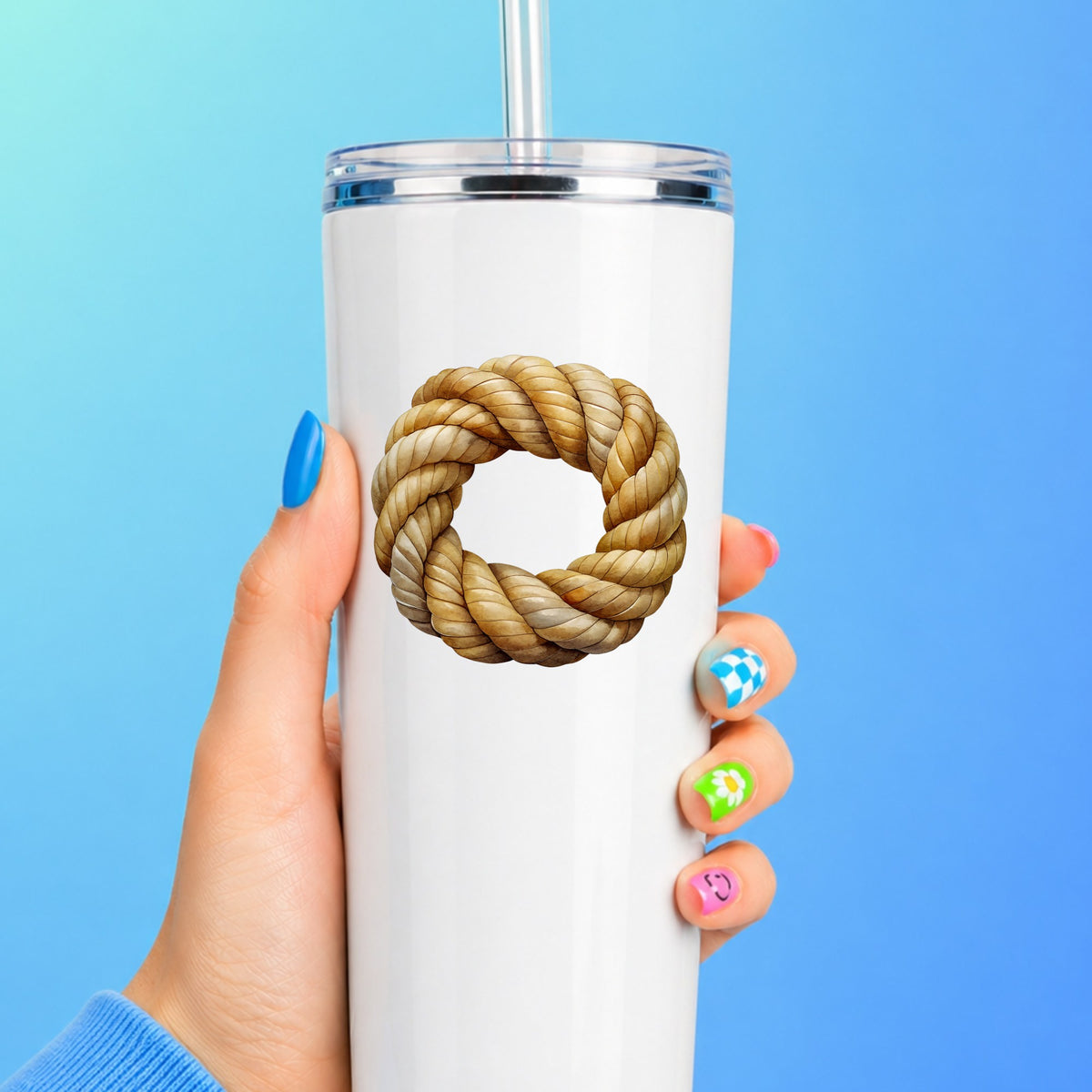 Rope Knot Wreath UV DTF sticker applied to a white straw tumbler on a blue background