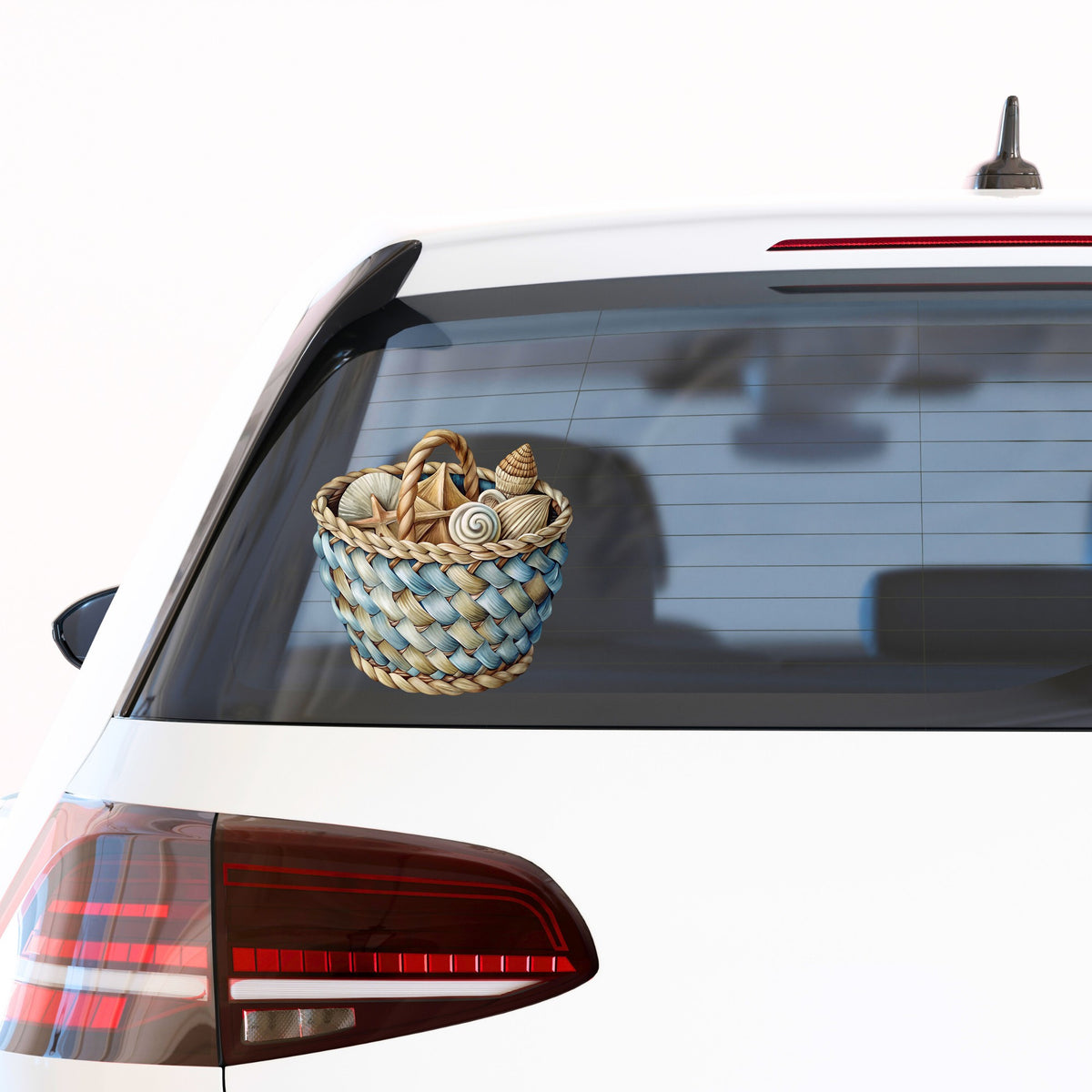 Woven Basket Of Seashells UV DTF sticker applied to the rear window of a white car