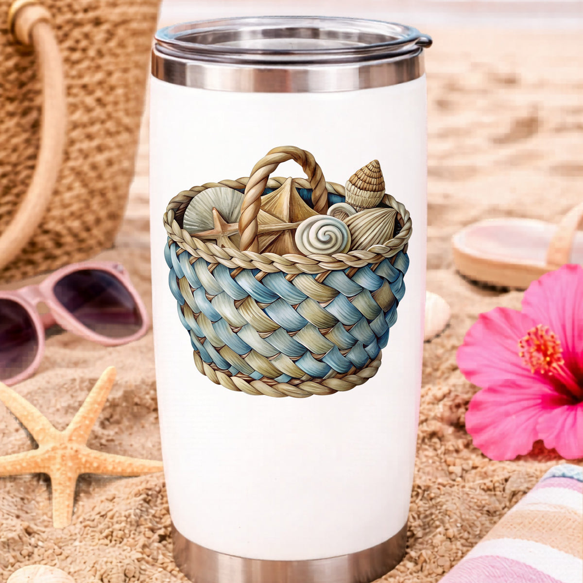 Woven Basket Of Seashells UV DTF sticker applied to a white travel tumbler on beach sand