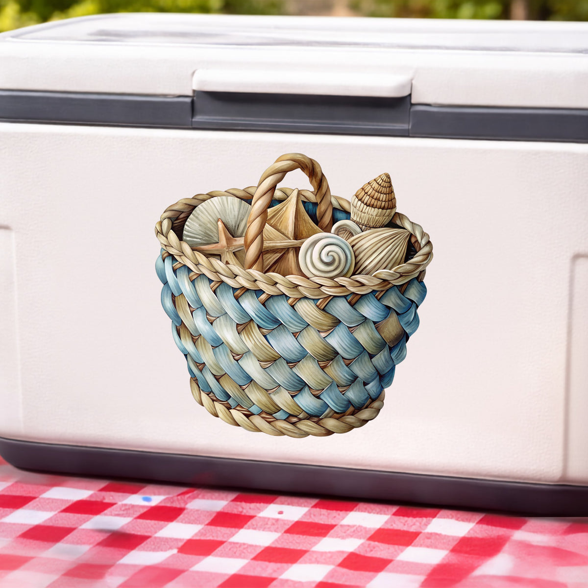 Woven Basket Of Seashells UV DTF sticker applied to a white cooler on a red gingham cloth
