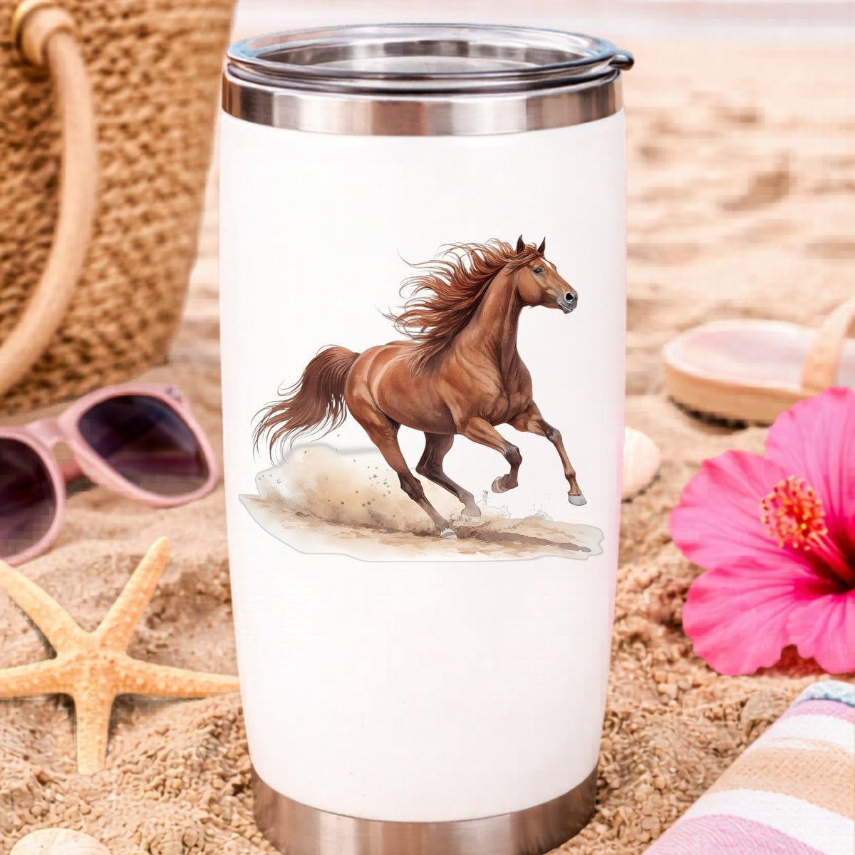 Chestnut Horse Galloping UV DTF sticker applied to a white travel tumbler on beach sand
