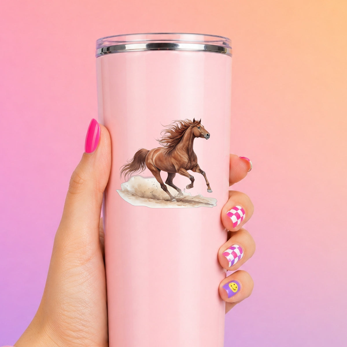 Chestnut Horse Galloping UV DTF sticker applied to a tall pink tumbler on a pink and orange background