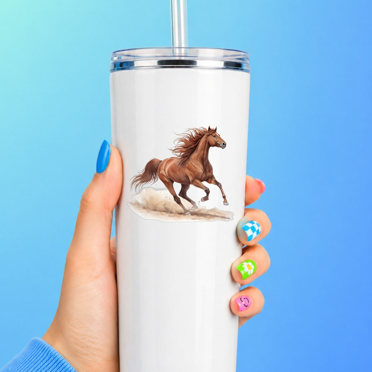 Chestnut Horse Galloping UV DTF sticker applied to a white straw tumbler on a blue background