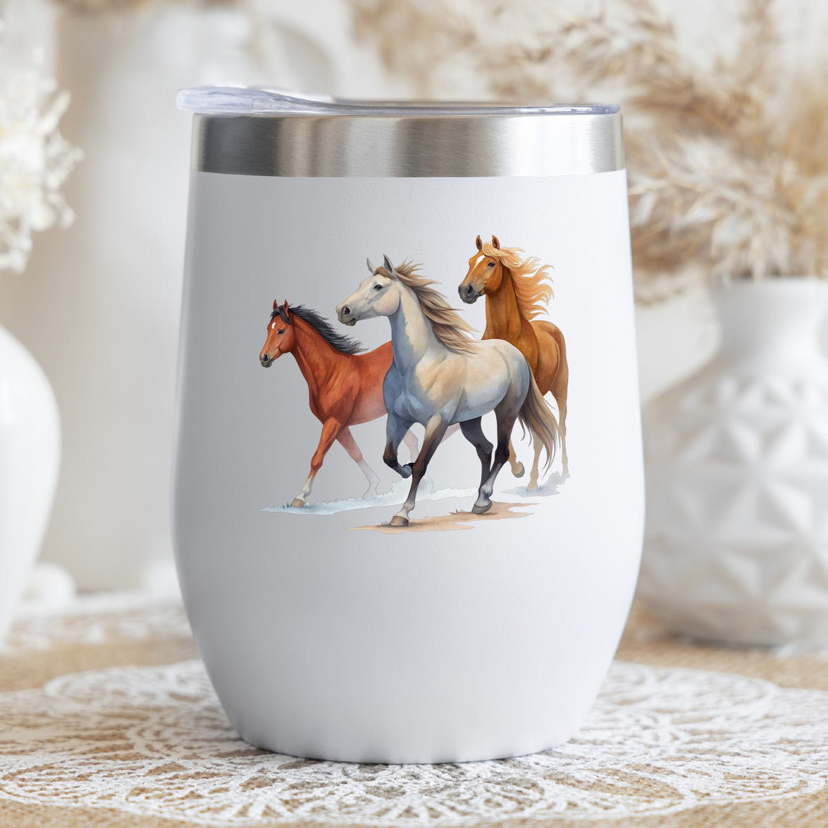 Three Horses Running UV DTF sticker applied to a white stemless tumbler with a lid