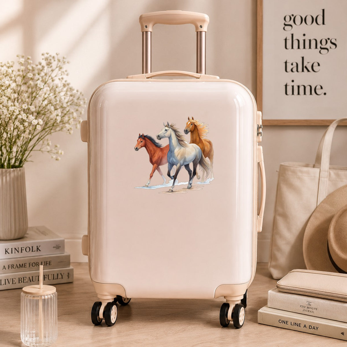Three Horses Running UV DTF sticker applied to a cream carry-on suitcase
