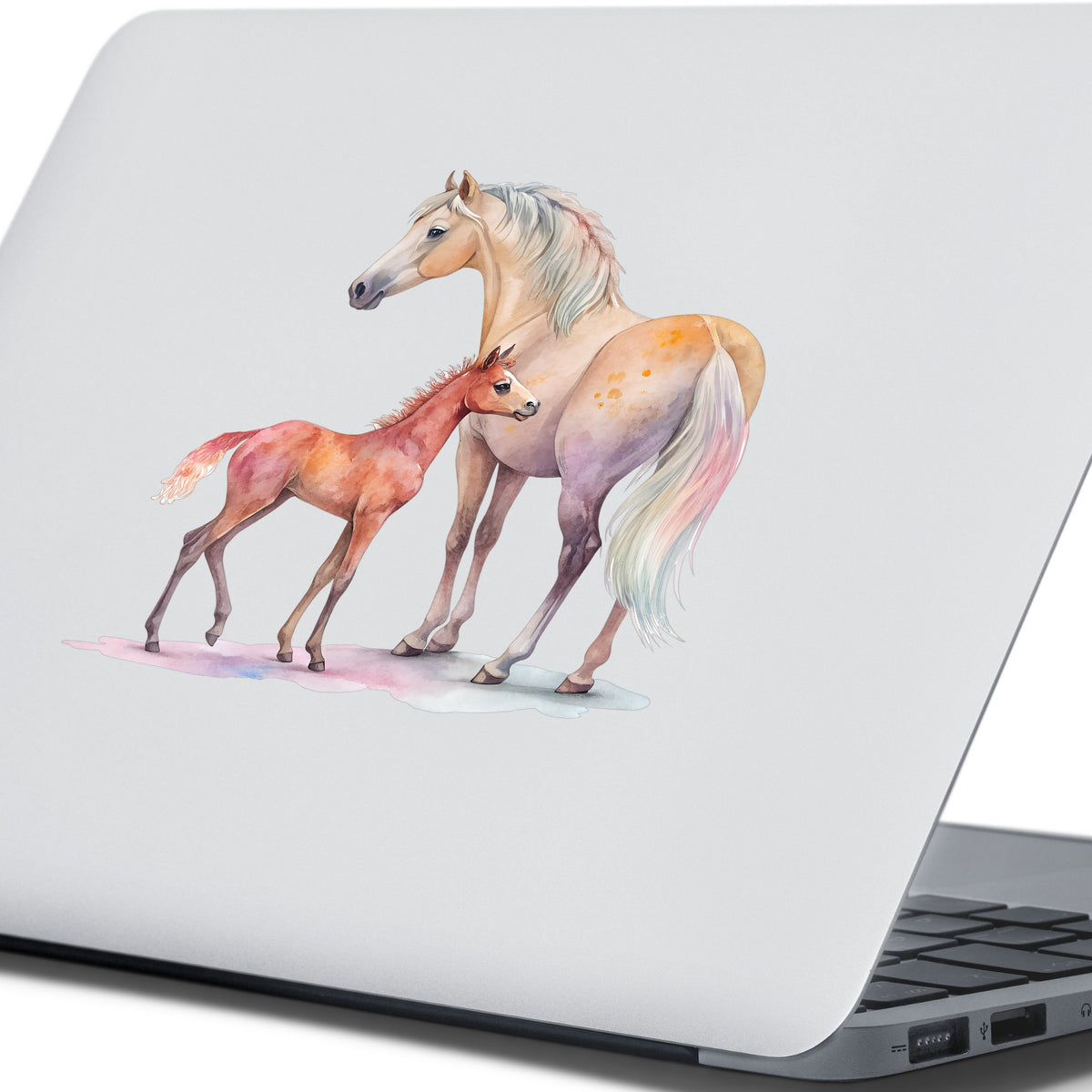 Pastel Mare And Pink Foal UV DTF sticker applied to the lid of a silver laptop