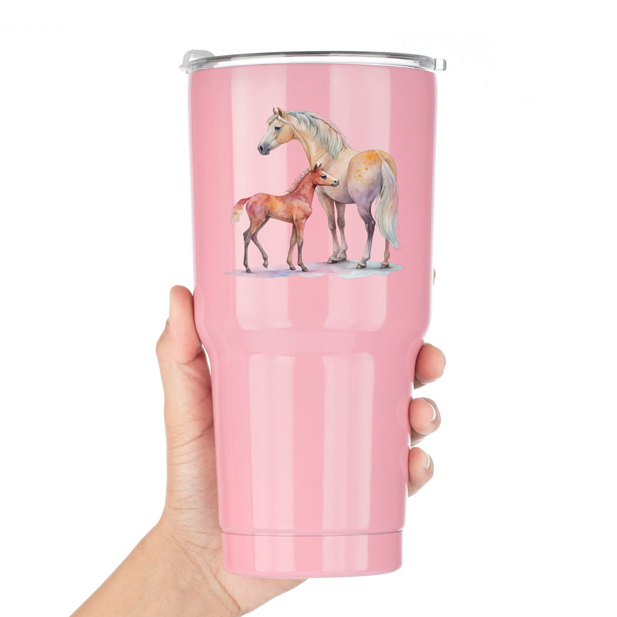Pastel Mare And Pink Foal UV DTF sticker applied to a pink tumbler held against a white background