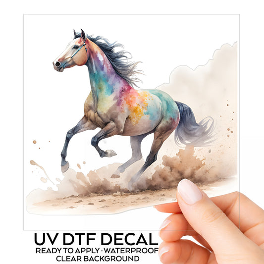 Colorful Horse Galloping In Dust UV DTF sticker on its backing card, held in hand