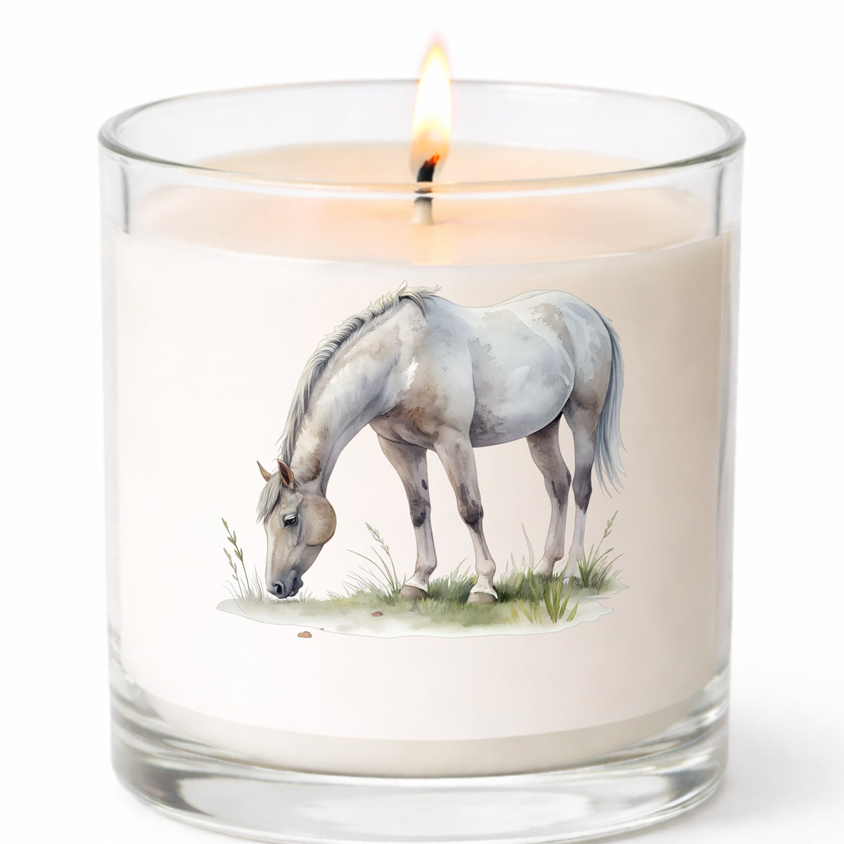 Gray Horse Grazing On Grass UV DTF sticker applied to a white candle in a clear glass jar