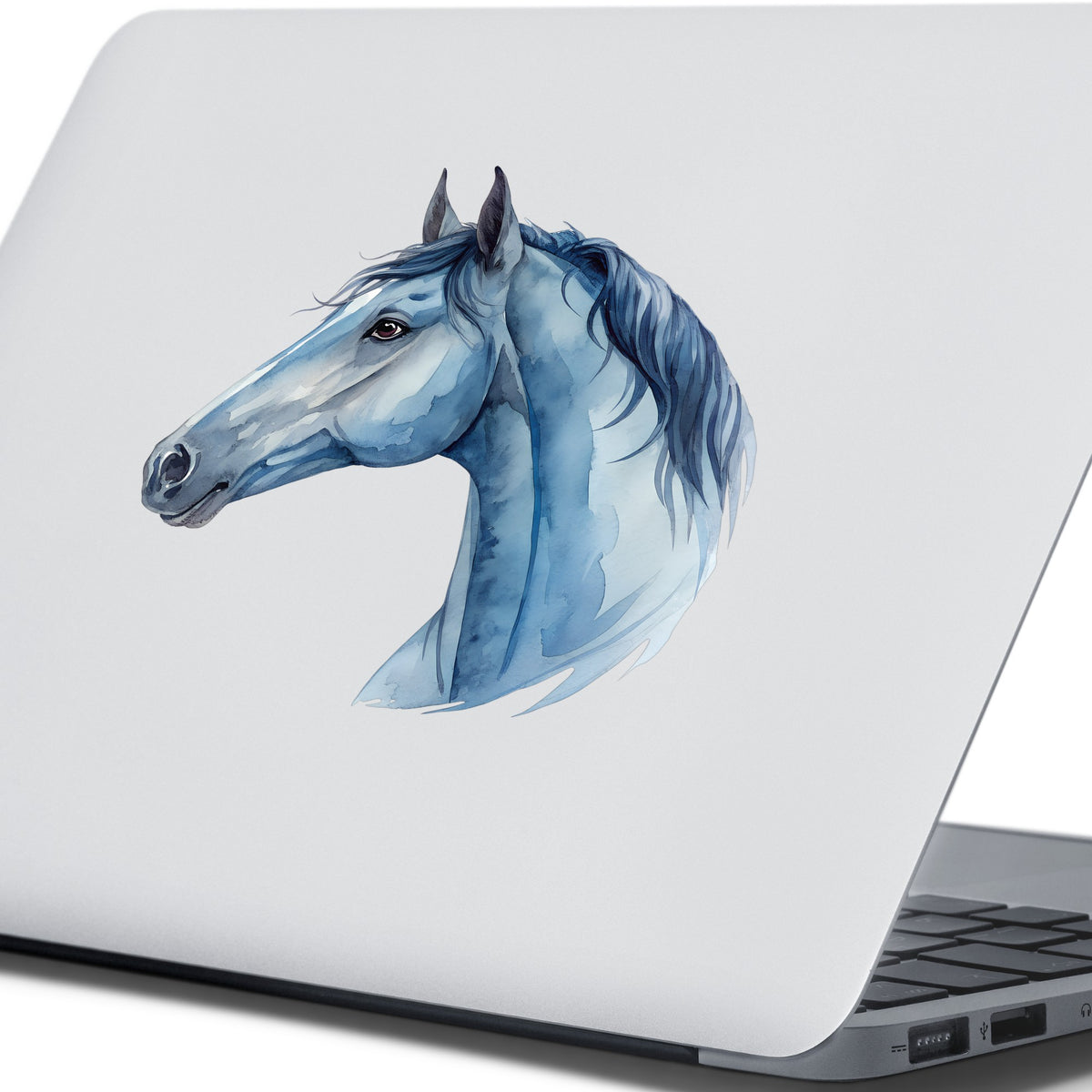 Blue Horse Head UV DTF sticker applied to the lid of a silver laptop