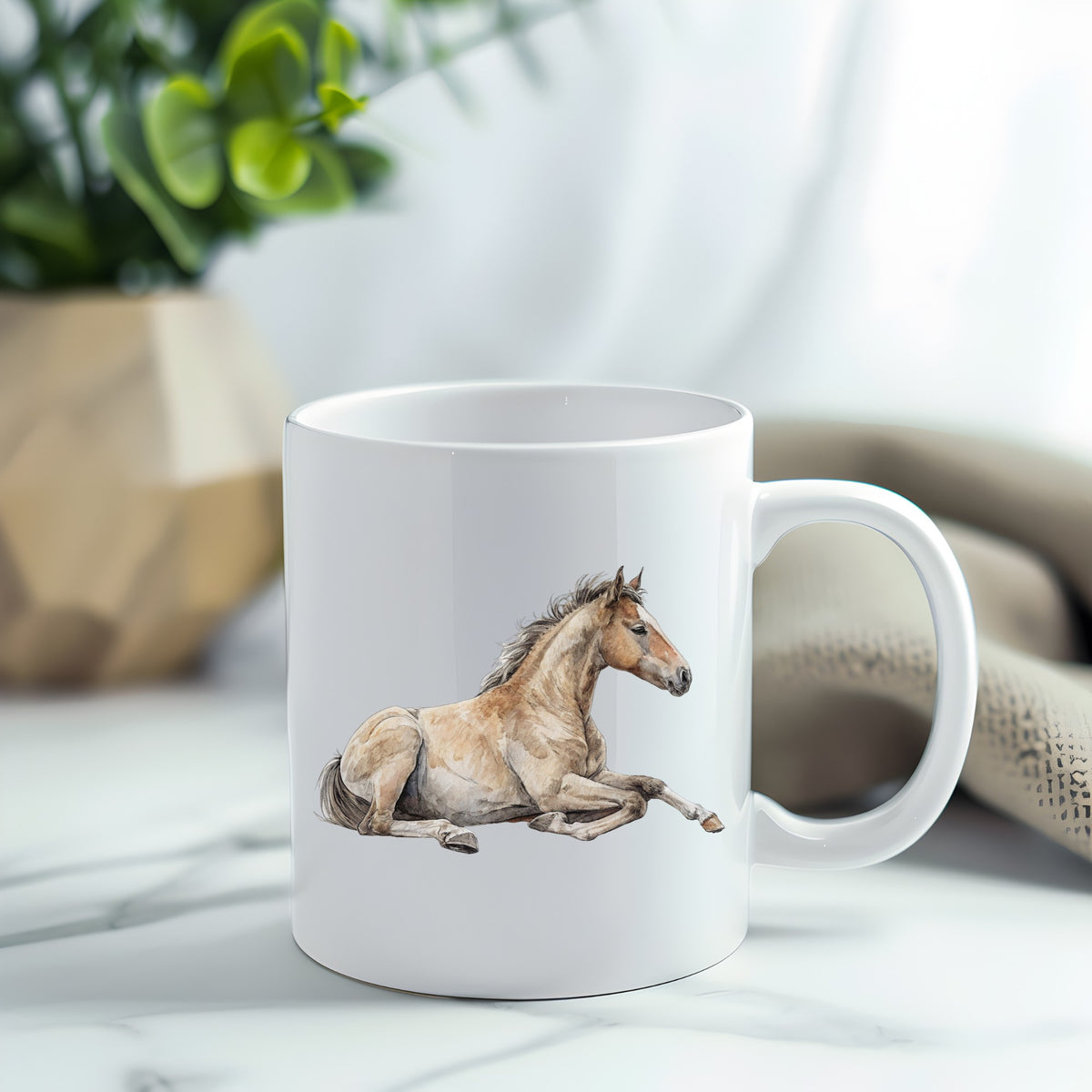 Buckskin Foal Lying Down UV DTF sticker applied to a white coffee mug