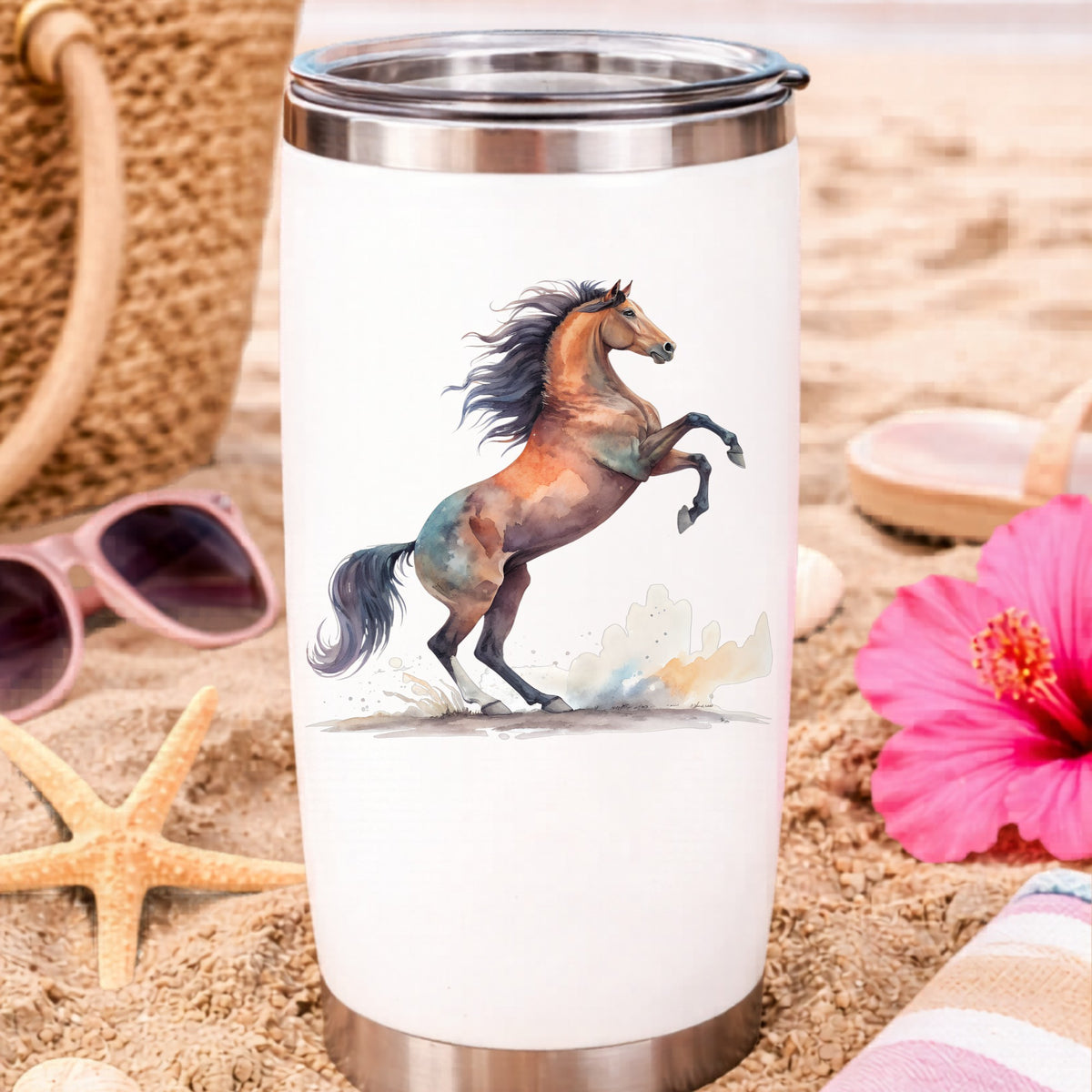 Bay Horse Rearing Up UV DTF sticker applied to a white travel tumbler on beach sand