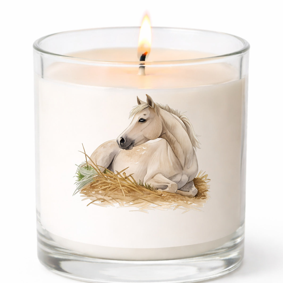 Cream Horse Resting In Hay UV DTF sticker applied to a white candle in a clear glass jar