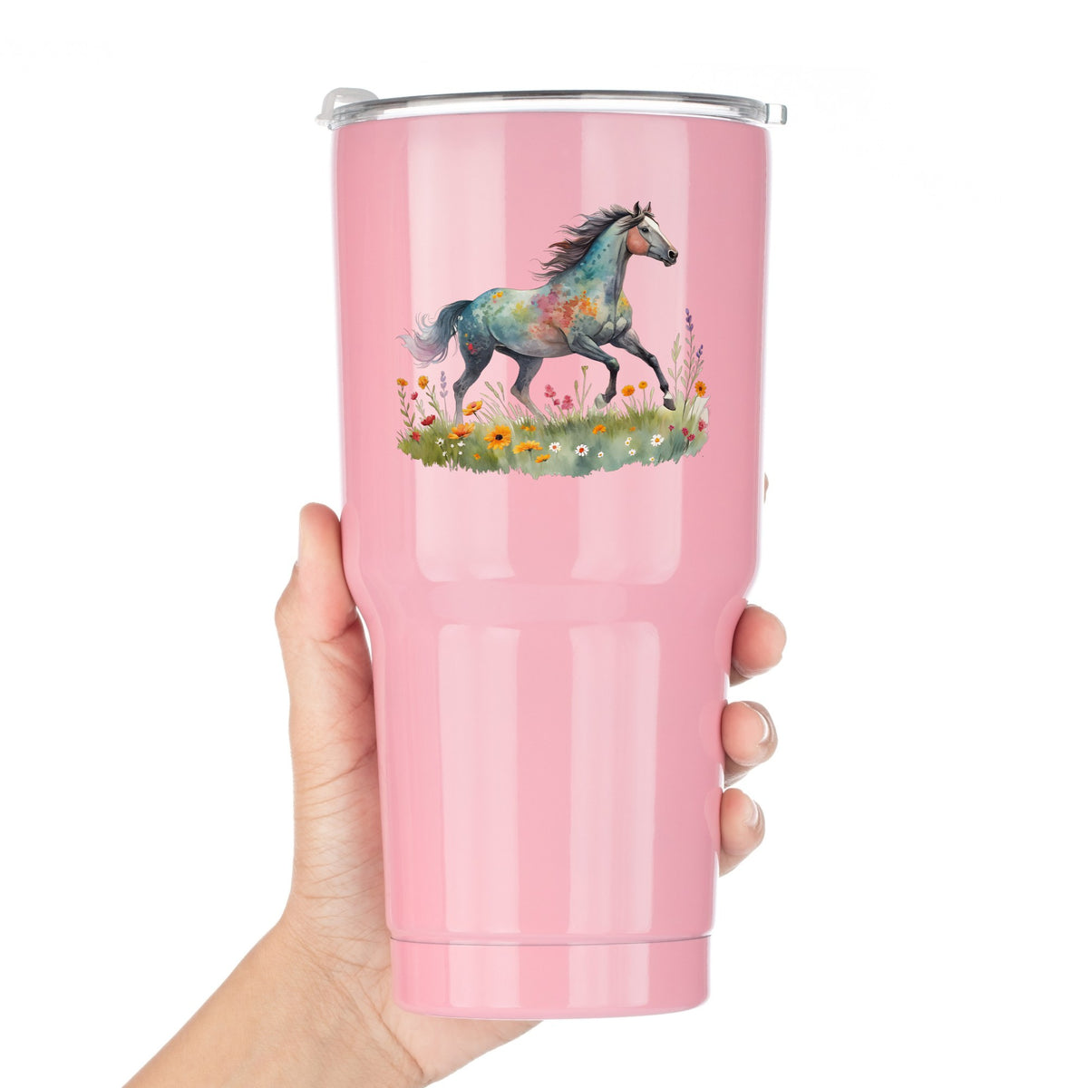 Floral Horse Running Through Wildflowers UV DTF sticker applied to a pink tumbler held against a white background